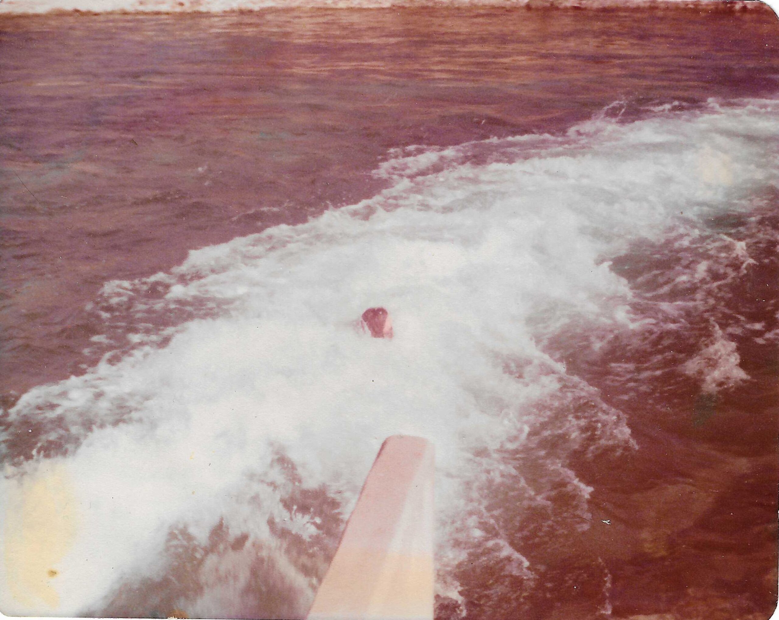 Historical 1977 photograph of the exit of the Comal River Tube Chute with tuber in New Braunfels Texas