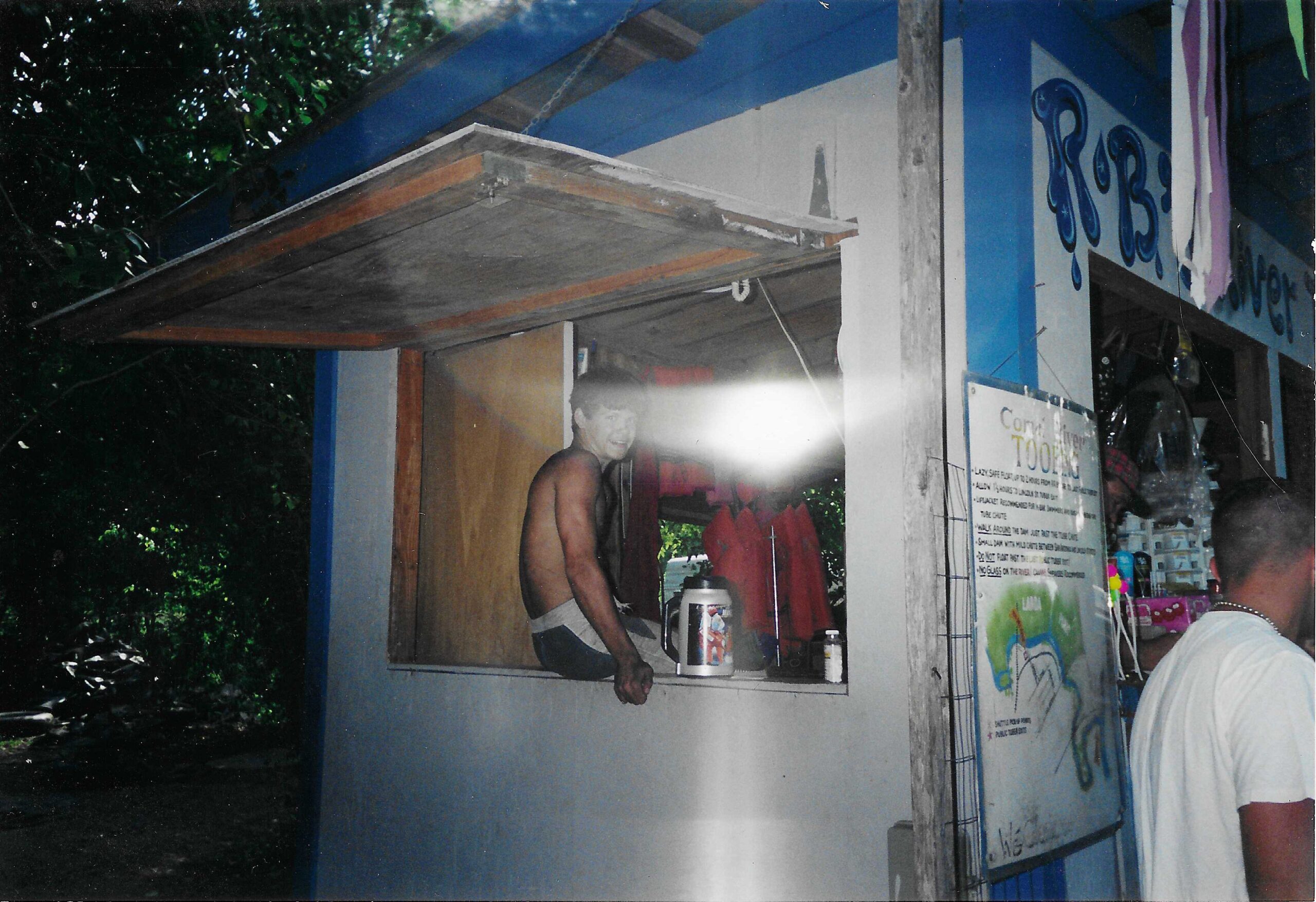Historic photograph of the Landa River Trips tube rental booth in the early 2000s on the Comal River in New Braunfels Texas