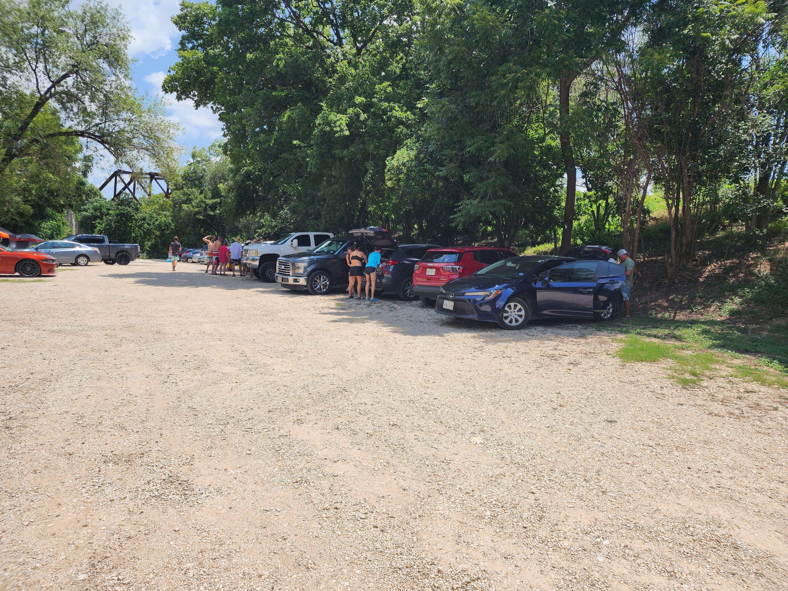 Landa River Trips gravel parking lot on the Comal River in New Braunfels Texas