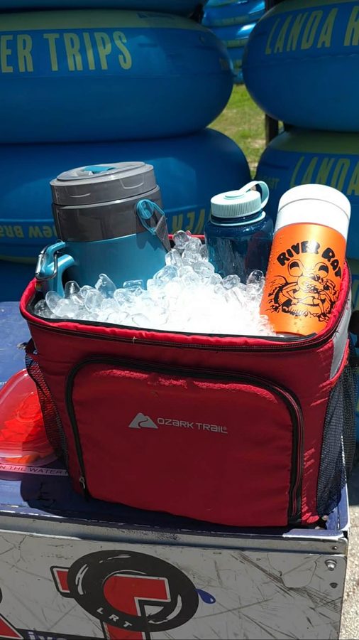 Soft-sided cooler packed with reusable containers and thermoses for Comal River tubing in New Braunfels